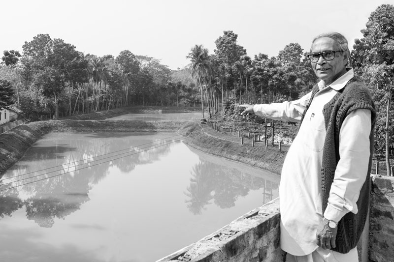 Kalipada Sarkar showing the pond in village Madhusudankati, North 24 parganas district, West Bengal, which is the source of arsenic-safe drinking water for the villagers